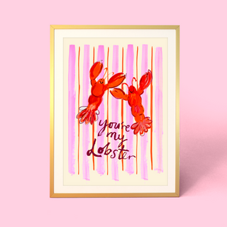 Framed artwork by Eleanor Bowmer with two red lobsters and 'you're my lobster' text on a pink and white striped background.