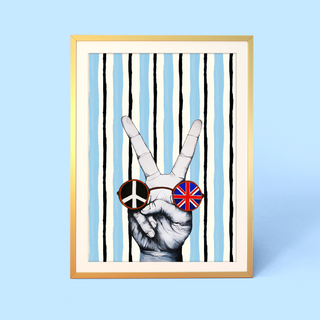 Framed artwork of a hand making a peace sign with sunglasses featuring peace and Union Jack designs on a blue background.