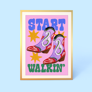 Eleanor Bowmer wall art with cowboy boots and 'Start Walkin'' text on a pink background