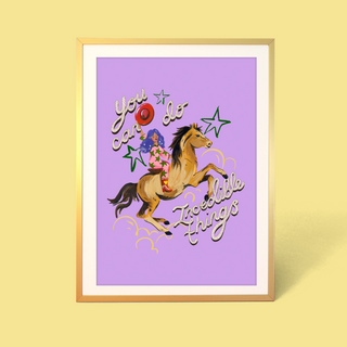 Eleanor Bowmer artwork with a cowgirl and motivational text on a purple background