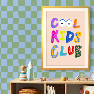 Whimsical print with multicoloured lettering that reads ‘Cool Kids Club’ on checkboard wallpaper by Eleanor Bowmer